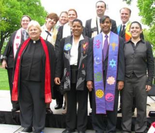 Unitarian Universalist clergy members pose for an outdoor picture.