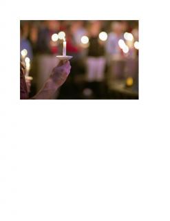 hand_holding_candle_lights_in_background