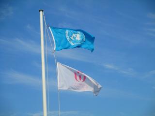 The flags of the United Nations and the Unitarian Universalist Association