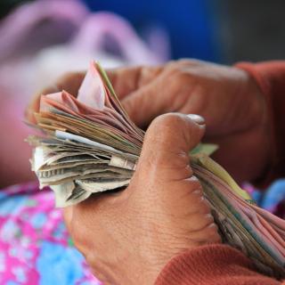 Hands holding money in closeup