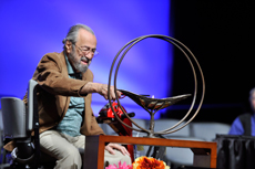 Man lights chalice during Plenary III of GA 2012. Photo by Nancy Pierce.