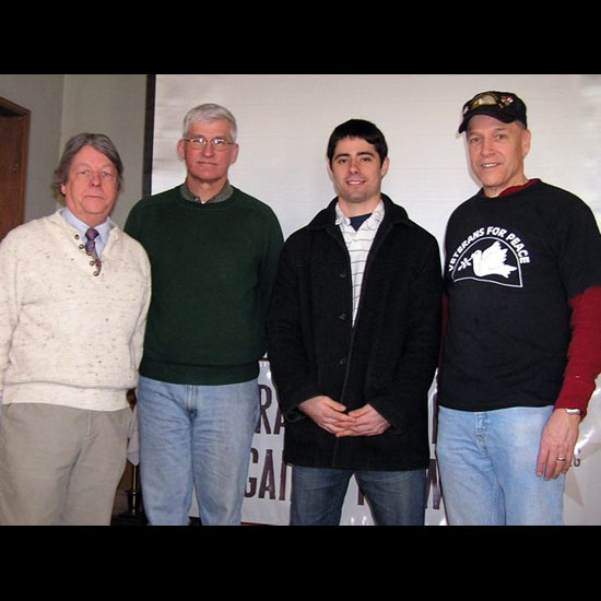 Rev. Dr. Art McDonald, Dr. Andrew Bacevich, Liam Madden, and Pat Scanlon, standing for a picture at the 'Iraq Veterans Against War' event sponsored by the First Unitarian Church of Essex, MA. Photo courtesy Art McDonald.