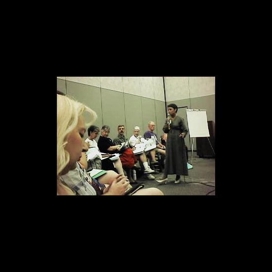 Rev. Donna DiScuillo (standing), UUA Young Adult Ministries director, leads a workshop. UUA archives.