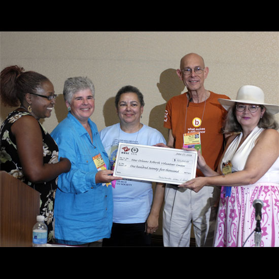 Representatives from the Unitarian Universalist Association and the Unitarian Universalsit Service Committee present a check for $125,000 to the New Orleans Rebirth Center. Photo by Nancy Pierce.