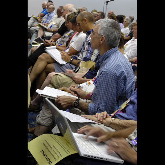 Participants in a workshop take notes on paper and laptops. Photo by Nancy Pierce.
