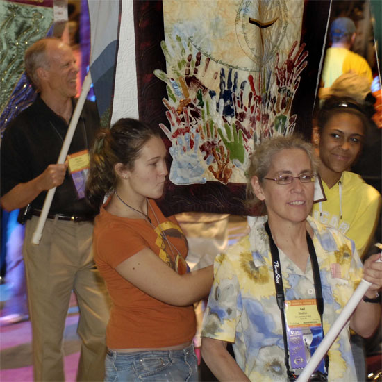 Unitarian Universalists carry banners identifying their congregations at the annual Banner Parade at General Assembly. Photo by Nancy Pierce.