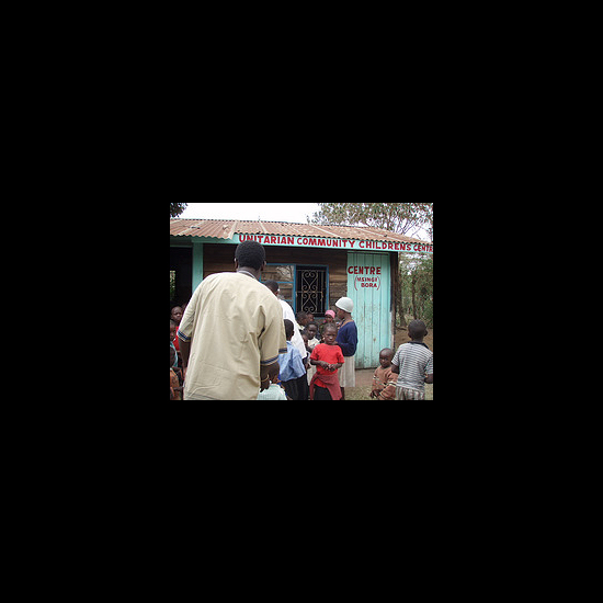 People stand outside of the Unitarian Community Children's Center. Patrice Curtis.