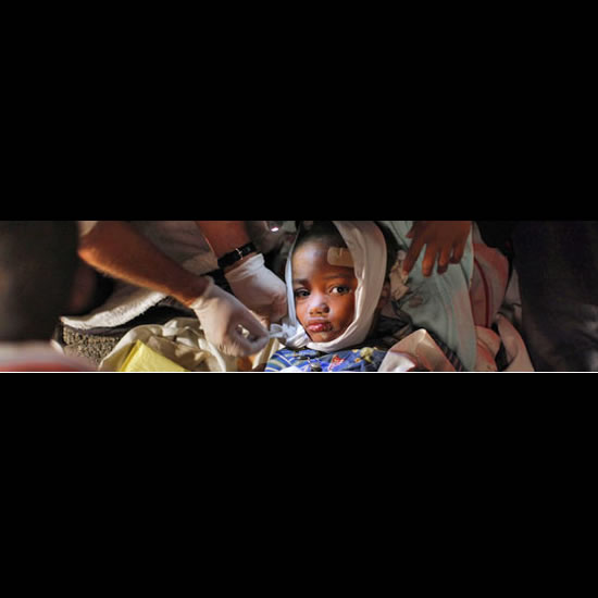 Young child receives care after earthquake in Haiti. Image from twitpic.com.