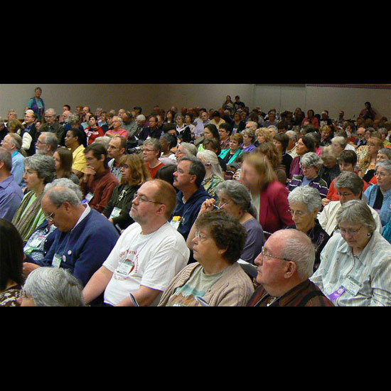 A room packed with Unitarian Universalists at the Church of the Larger Fellowship annual worship service. Photo by John Melski.