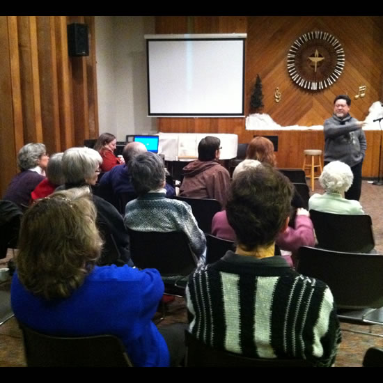 UU Society of Black Hawk County, Cedar Falls, IA discuss their work with an immigrant family. Photo by Heather Flory.