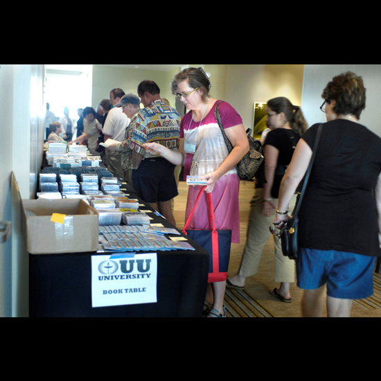 People browse the UU University book table. Nancy Pierce.