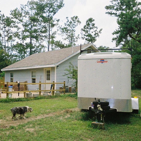 Rick Galle's house and dog in Kiln, Mississippi. Photo courtesy Suzanne Legarde.