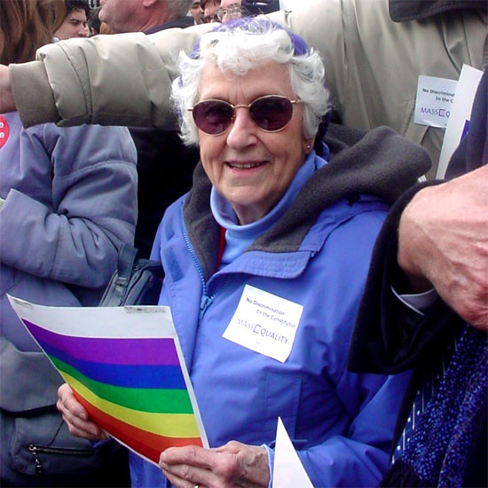 Natalie Gulbrandsen holding a rainbow placard at a same sex marriage rally in 2004. 