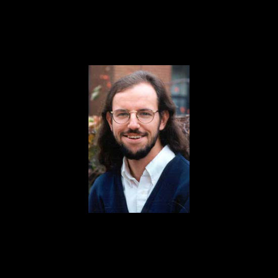 Daniel McKanan, smiling in an outdoor headshot. Photo courtesy Daniel McKanan.