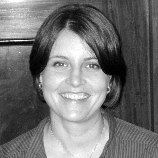 Parisa Parsa, smiling for a black-and-white headshot. Photo courtesy Parisa Parsa.