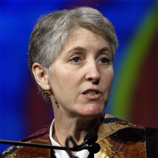 Victoria Safford, speaking at a microphone. Photo by Nancy Pierce.