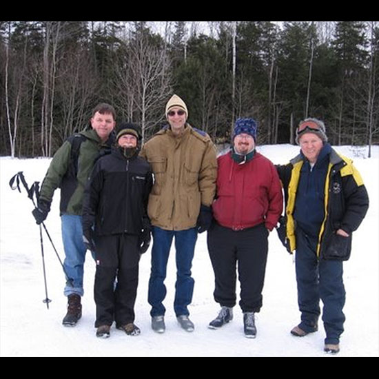 Five members of the First Church Unitarian, Littleton, MA, men's group pose in their ski gear. Photo courtesy Jim Barisano.