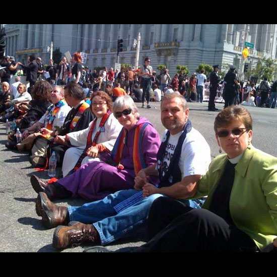 Unitarian Universalist Dennis Paul seated in a line of clergy during civil disobedience for marriage equality. Photo by Adams Blons.