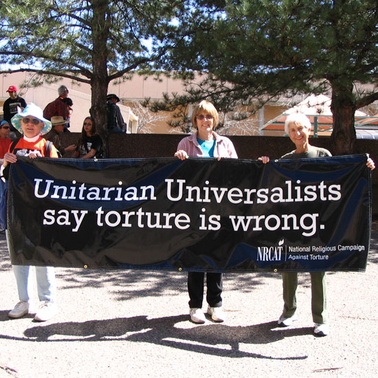 Unitarian Universalists in Albuquerque, NM, hold a banner that reads, 'Unitarian Universalists say torture is wrong. NRCAT (National Religious Campagin Against Torture).' Photo courtesy NRCAT.