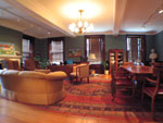 President's office with a long meeting table, sofa, chairs, and desk. Photo by UUA.