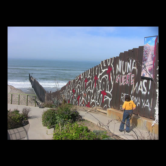 The Border Wall in Tijuana, running out into the Pacific. Photo by Adam Gerhardstein.