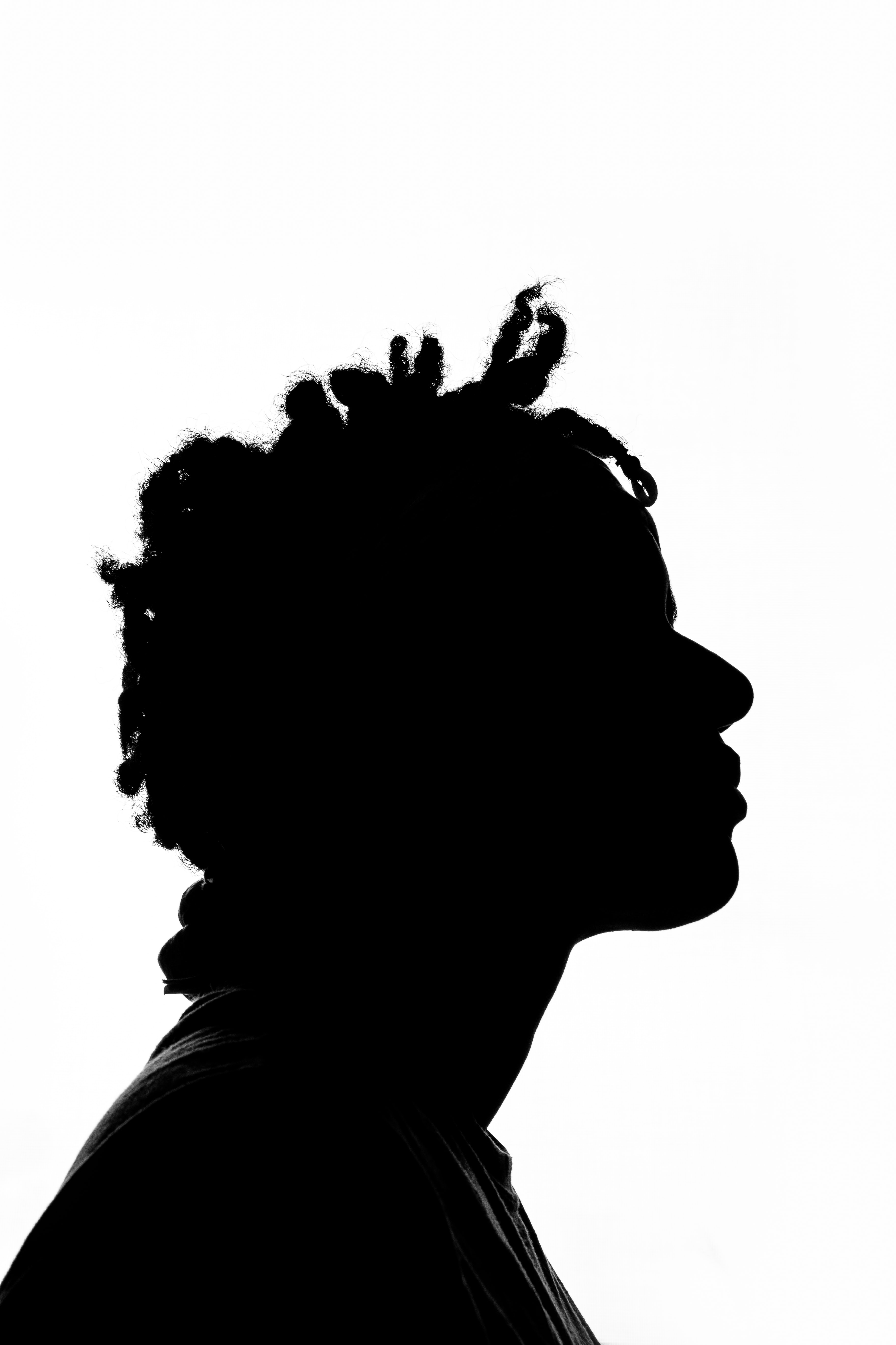 The profile of a person whose hair texture reveals that they are Black