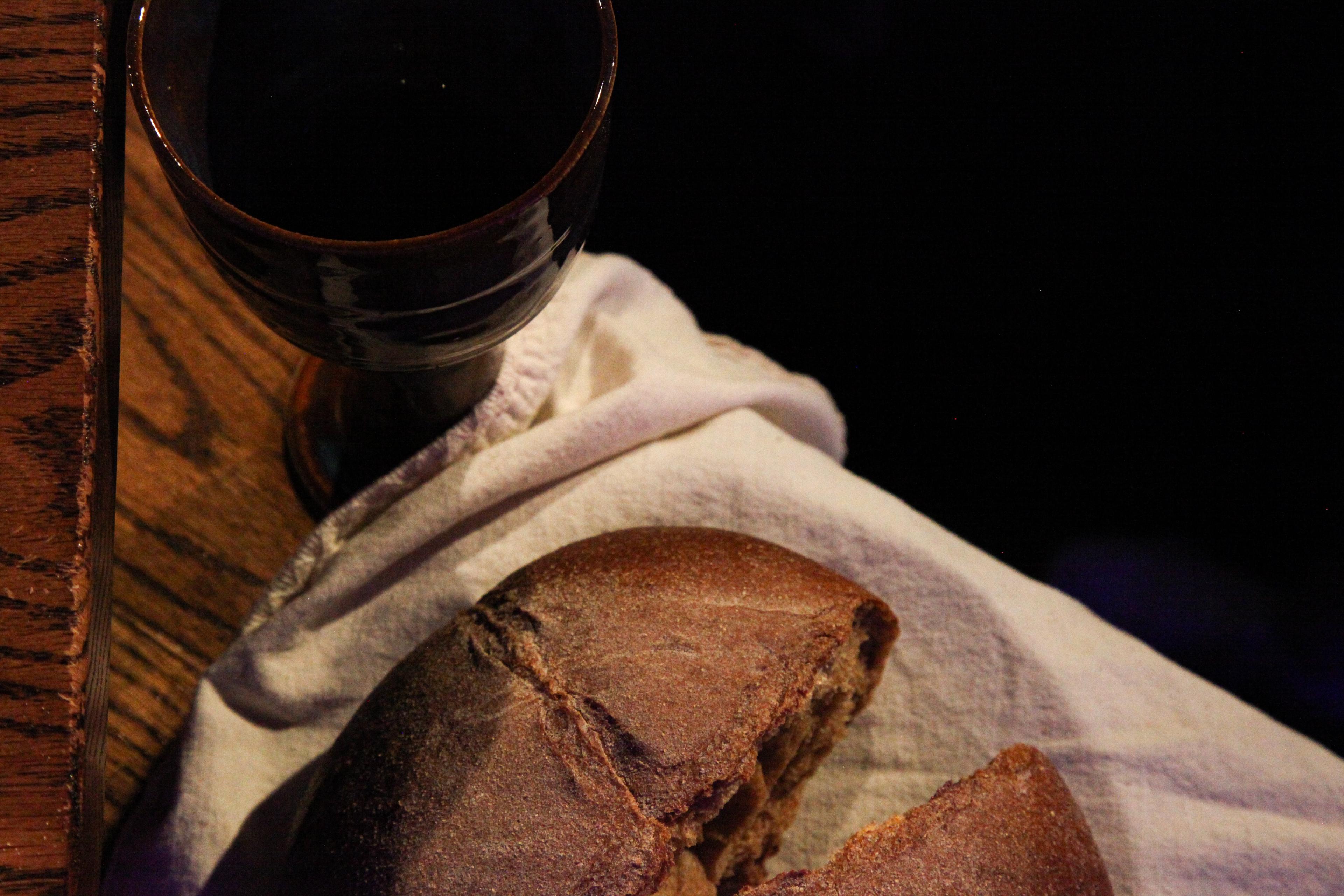 A loaf of bread and goblet of juice for communion at church.