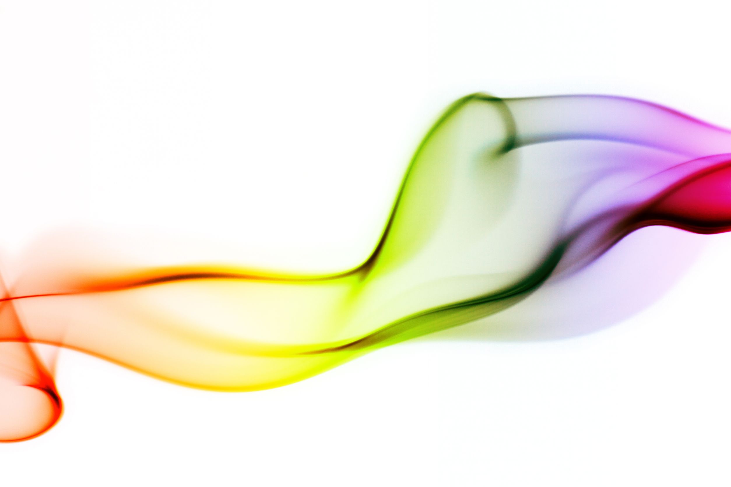 a horizontal wisp of orange, yellow, green, and purple smoke