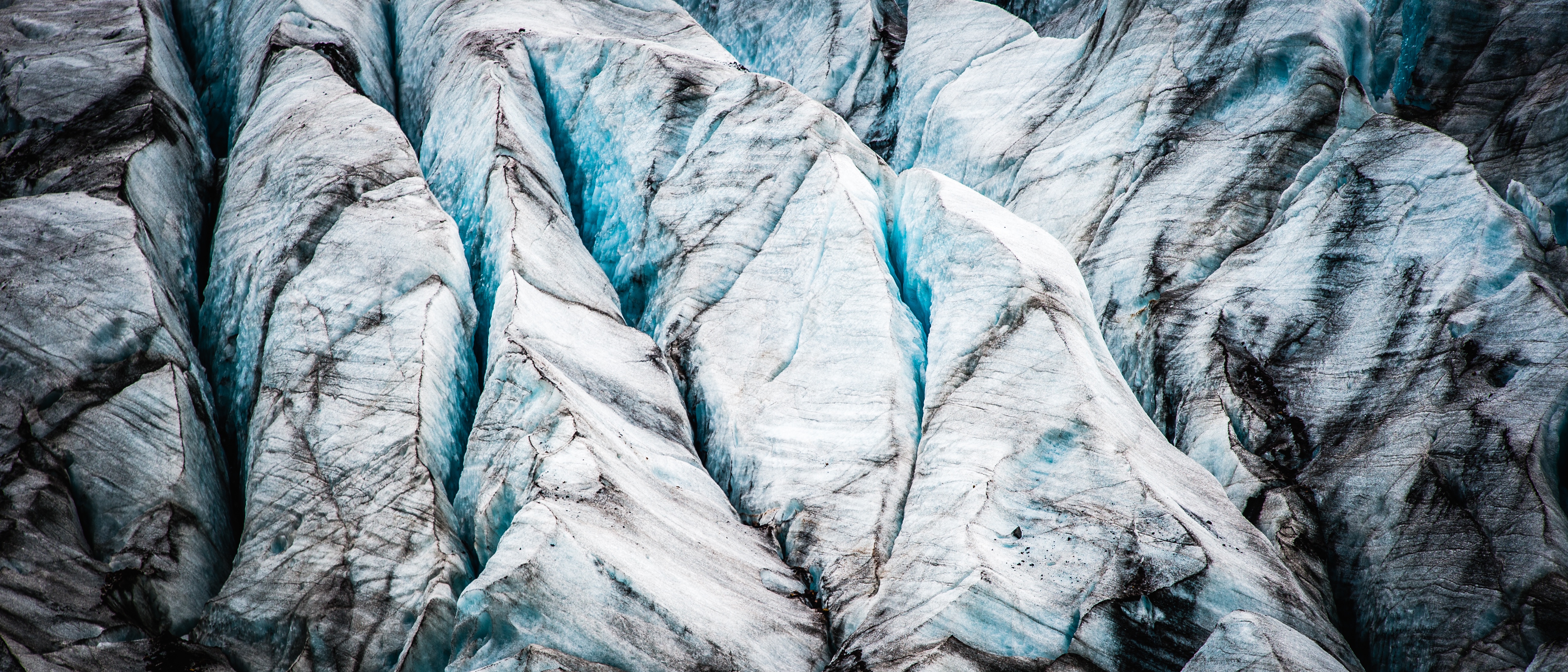 The deep blue crevices of an Icelandic glacier.