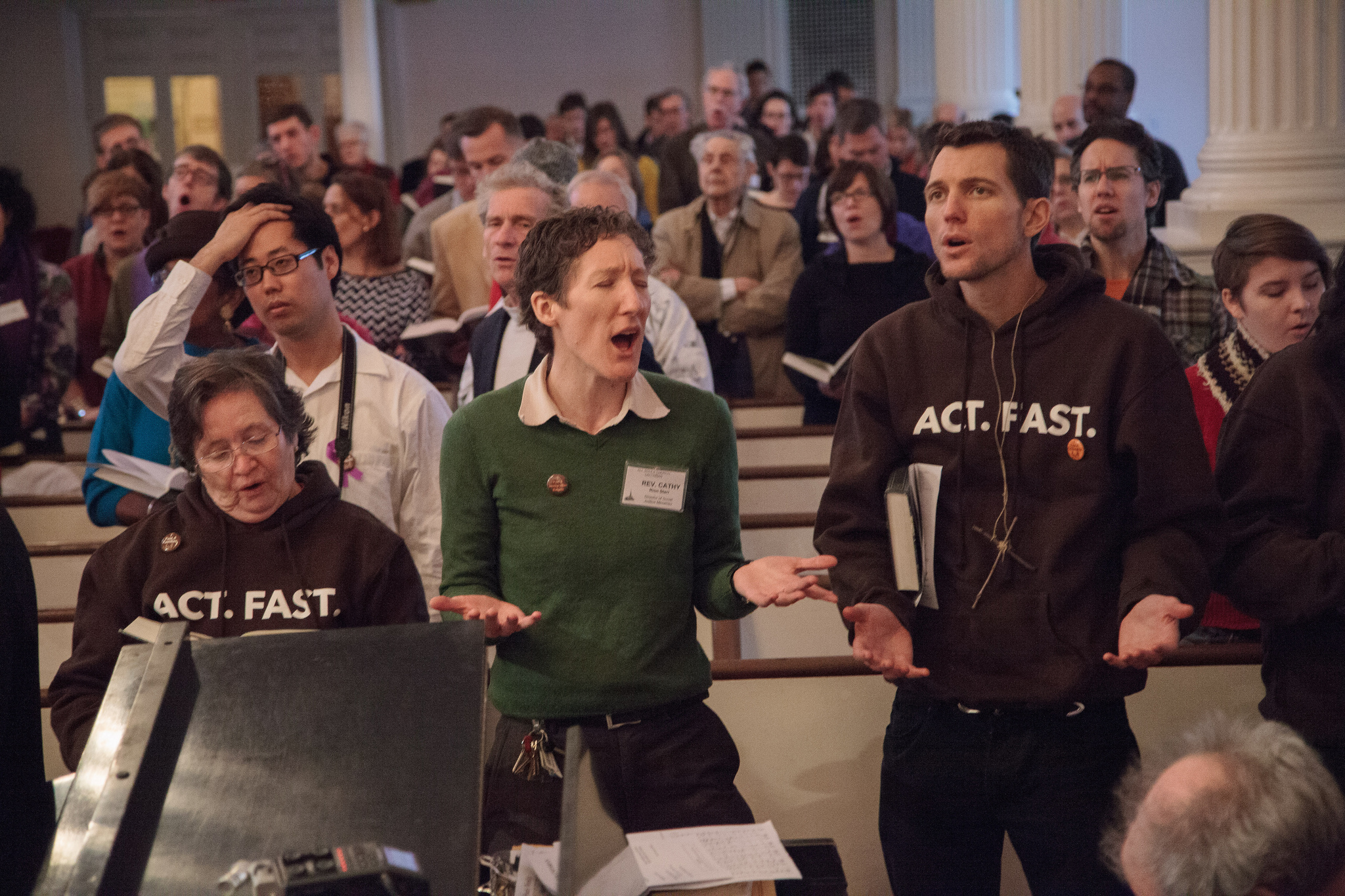 In a UU sanctuary, people sing together