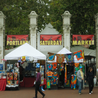 A street level photo of the busy open-air market in Portland Oregon.