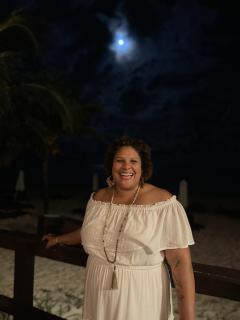 Shannon Harper in a white dress under the light of the moon