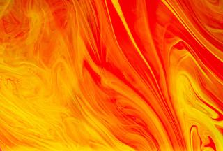 An abstract image of swirling colors ranging from yellow to orange, reminiscent of fire.