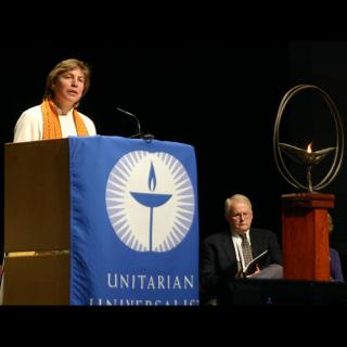 Rev. Alison M. Cornish, speaking from behind a podium.