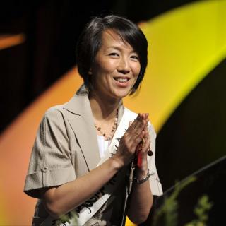 The Rev. Kosho Niwano, president designate of Rissho Kosei-kai, held her hands together and smiled as she addressed the UUA General Assembly.