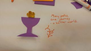 Chalice with the words "Many Paths, one journey, a better world.
