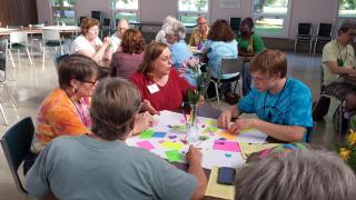 Small group of UUs in discussion during a World Cafe event