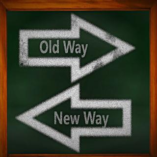 Opposite arrows drawn on chalk board labelled "old way" and "new way"