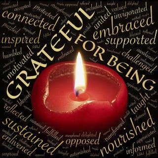 candle surrouned by Grateful for being and other words of gratitude