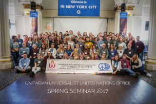 Group picture of participants at the 2017 Spring Seminar with a sign reading "Imagine a world without nuclear weapons - let's make it happen! Unitarian Universalists United for Peace and Planet"