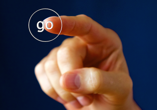 Hand clicking on a "go" button