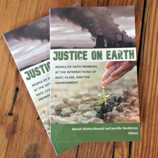 Copies of the book Justice on Earth arranged on a wooden bench