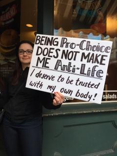 A white woman at the Boston Women's March holds a sign: "Being Pro-Choice does not make me Anti-Life."