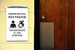 A sign designating a public restroom as gender neutral restroom.