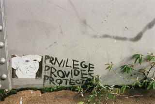 At the bottom of a wall, three words are painted: privilege provides (+) protects
