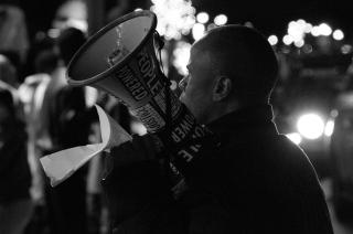 a man holding a megaphone at a Black Lives Matter protest in Memphis