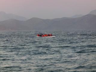 A rubber boat containing about 50 refugees on the Greek coast