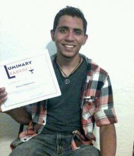 Steven Ballesteros holds his Luminary Leaders Certificate of Recognition.