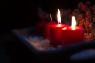 Two lit candles on an advent "wreath"