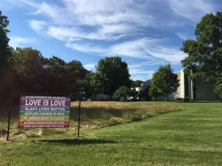 A large "banner for the resistance" posted on the lawn of the UU Church at Washington Crossing (NJ)